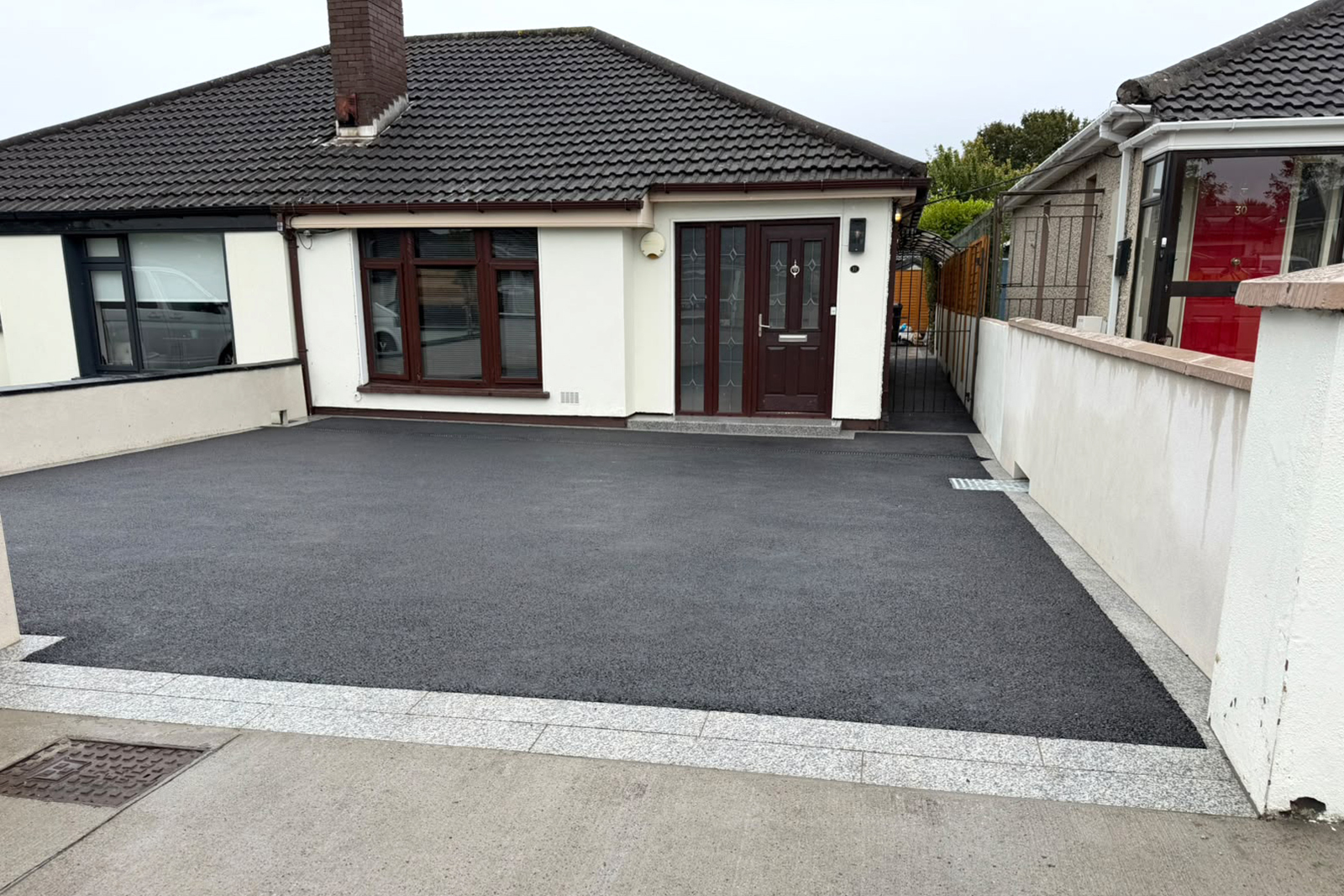 Completed fine SMA tarmac driveway with granite edging at Oak Court Lawn Dublin 20